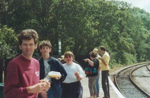 Isle of Wight 1996 After getting off the Island Line train at Smallbrook Junction, the group are seen having their lunch whilst waiting for the steam train to arrive. David, Adrian, Louise, Mary, Steve and John are seen on the photo.