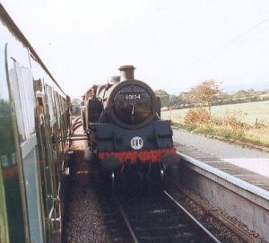 Std Tank No 80104 is seen passing our train at Harman's Cross station, which is now a passing point for a two or three train service.