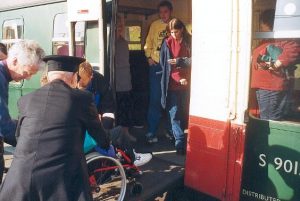 Adam is seen being unloaded from the coach helped by Howard, Steve and the guard after arrival back at Swanage.